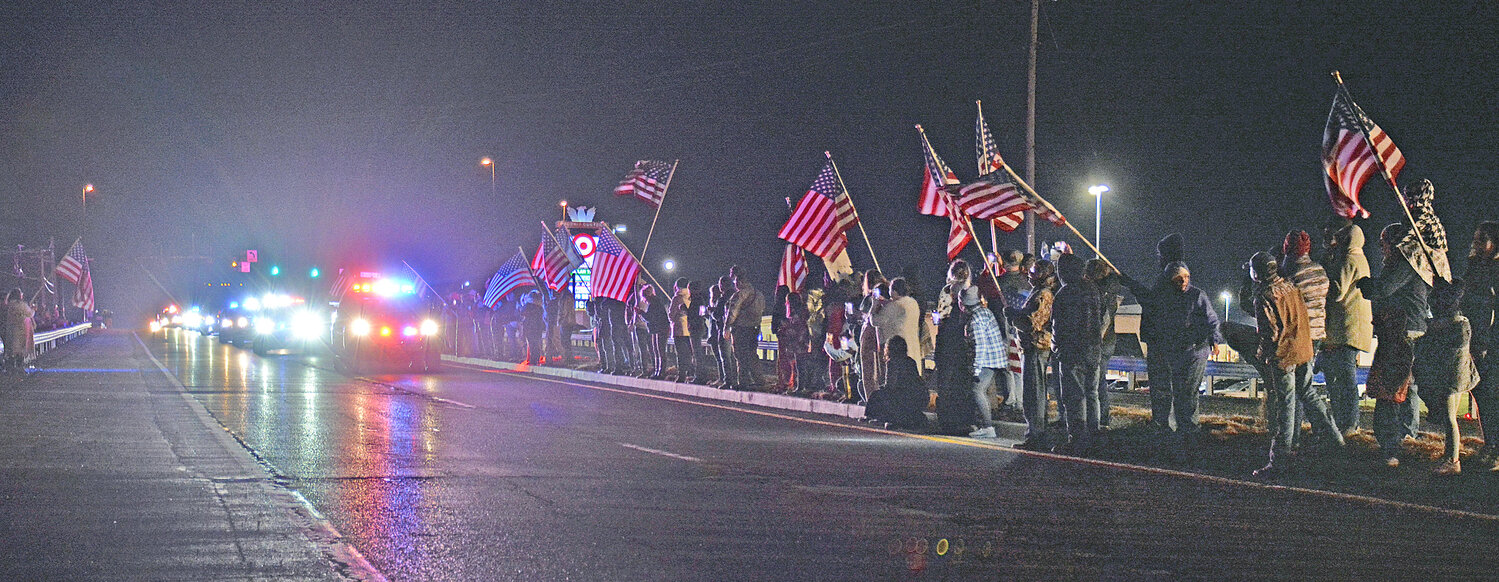 Supporters of Sullentrup lined the roadway Tuesday evening as the emergency vehicle escort arrived in Washington following his flight home from Colorado to Lambert International in St. Louis.